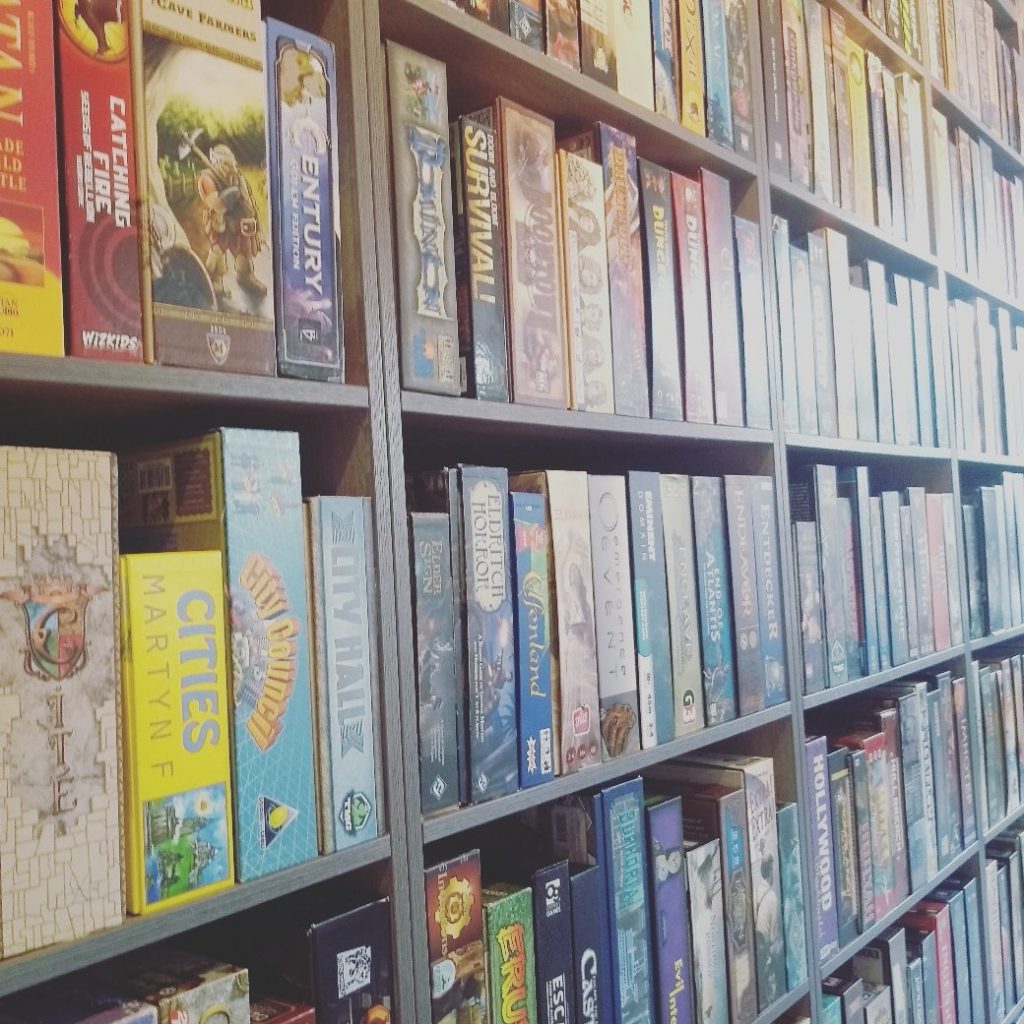 Bookshelves full of board games at the Ludorati cafe, Nottingham